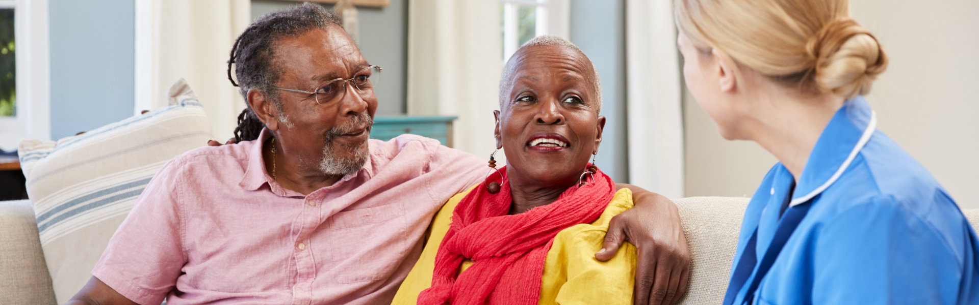 a couple talking to a medical nurse